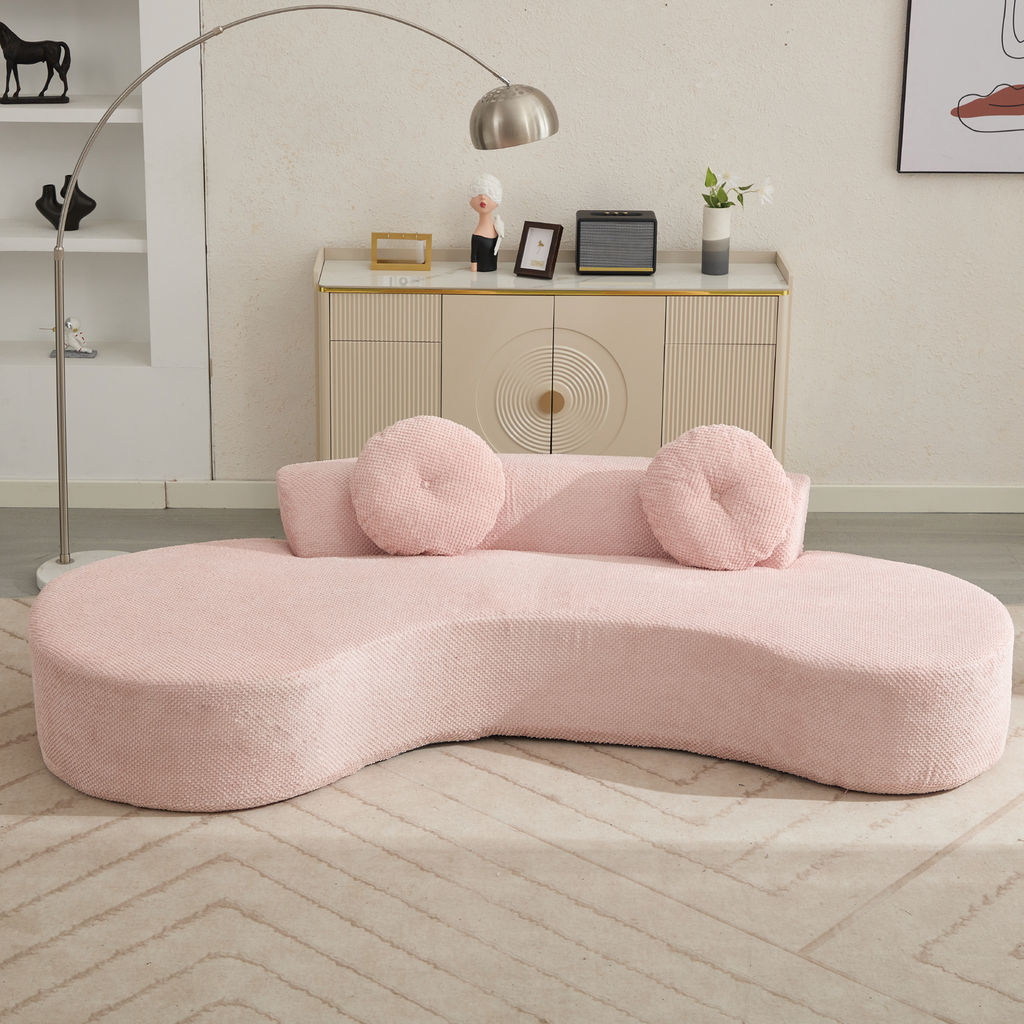 Curved pink boucle sofa with round throw pillows modern living room furniture
