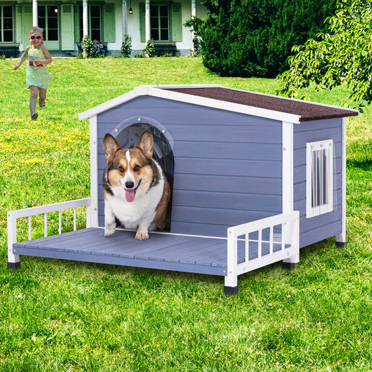 Charming grey wooden dog house with a covered porch and a happy Corgi emerging