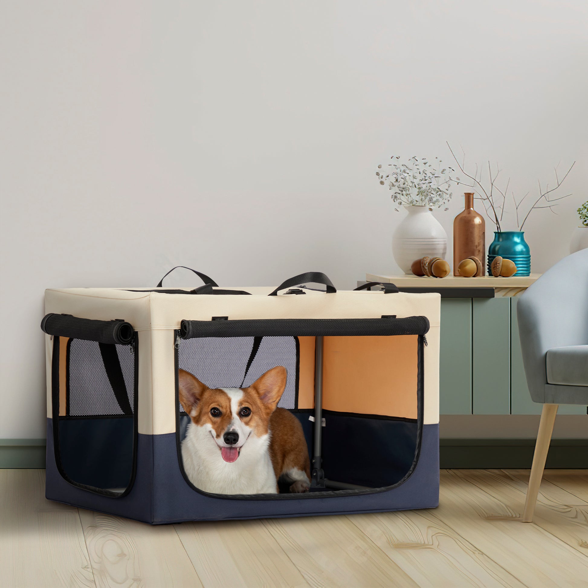 Portable pet carrier in beige and navy blue with mesh windows and a happy corgi inside