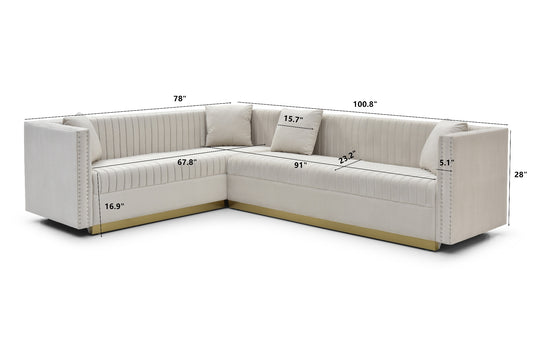 Tufted beige velvet sectional sofa with nailhead trim and gold base