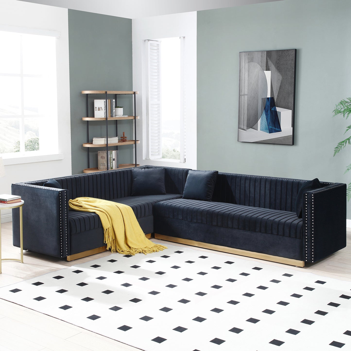 Deep navy velvet sectional sofa with tufted channeling and silver nailhead trim
