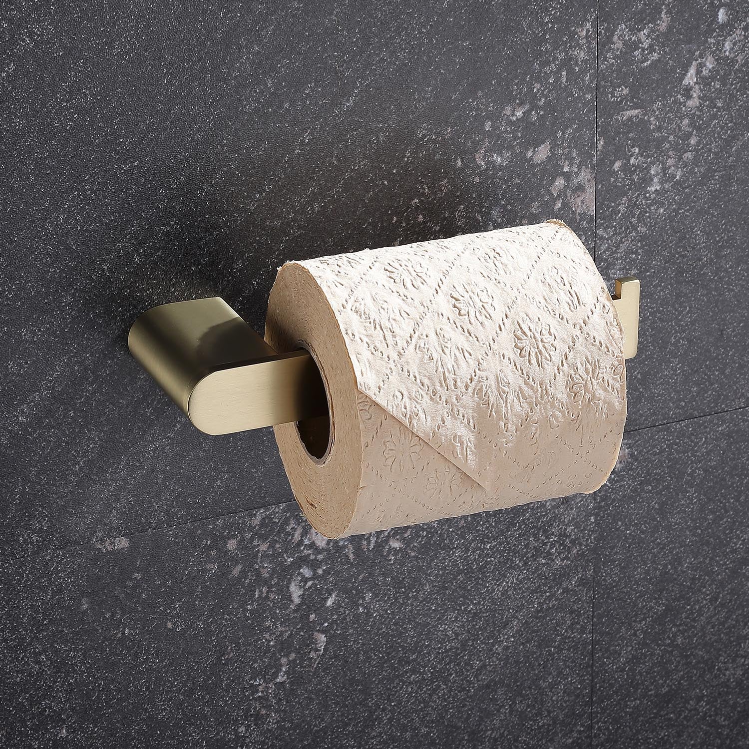 Brushed brass toilet paper holder with embossed toilet paper roll