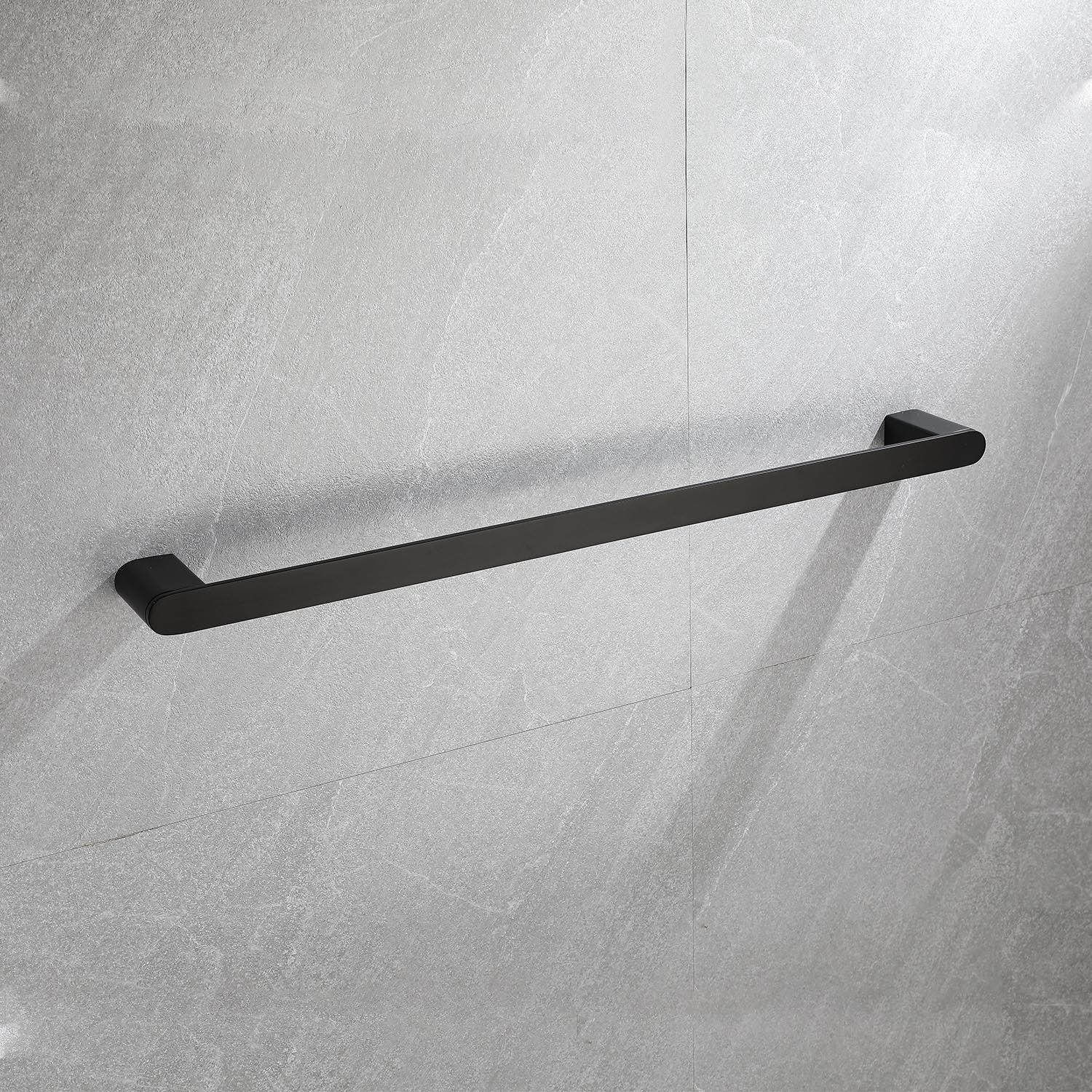 Sleek black metal bathroom towel bar mounted on grey tiled wall