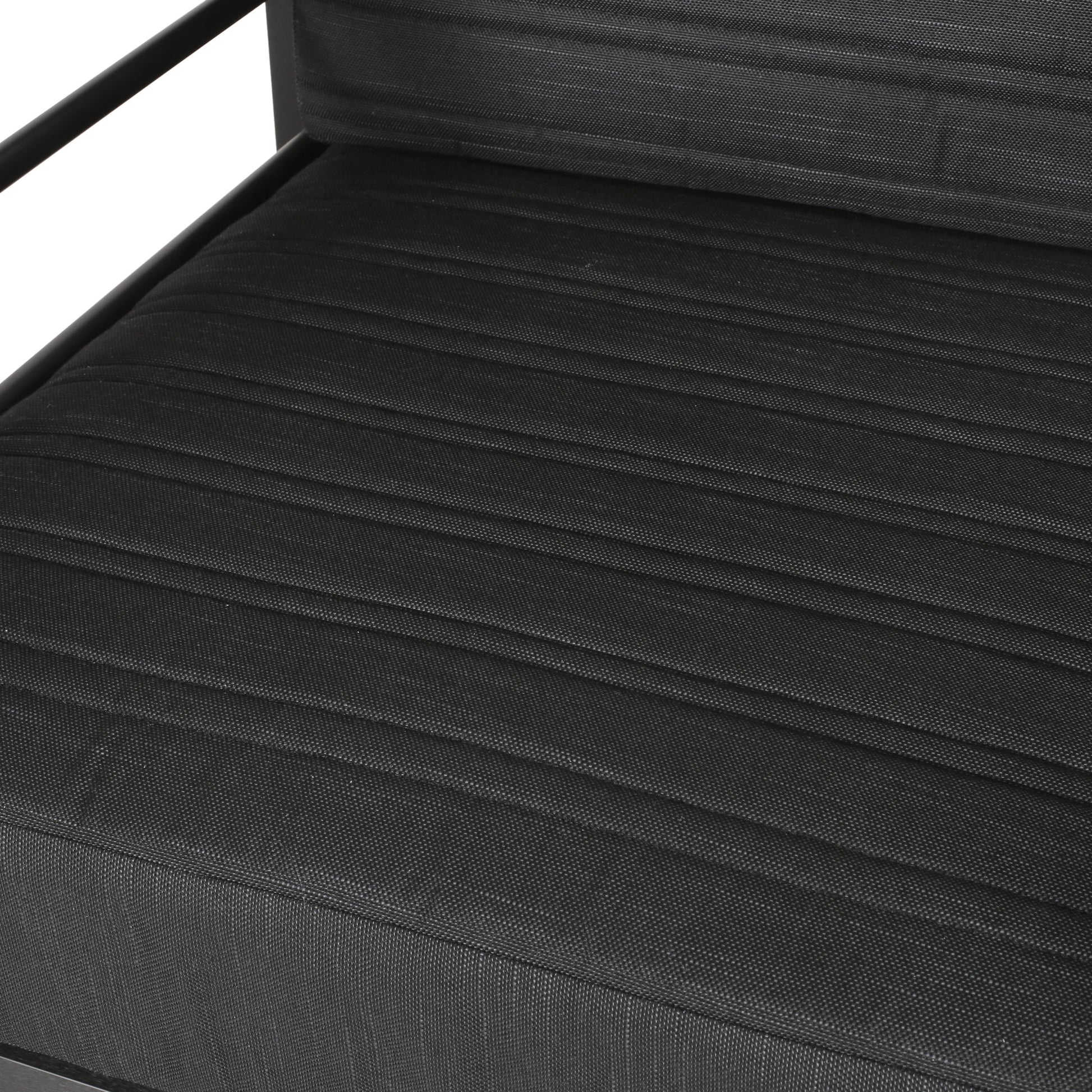 Black upholstered outdoor furniture seat with textured fabric and metal frame