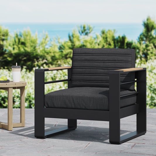 Modern charcoal outdoor armchair with sleek black frame and natural wood armrest accents