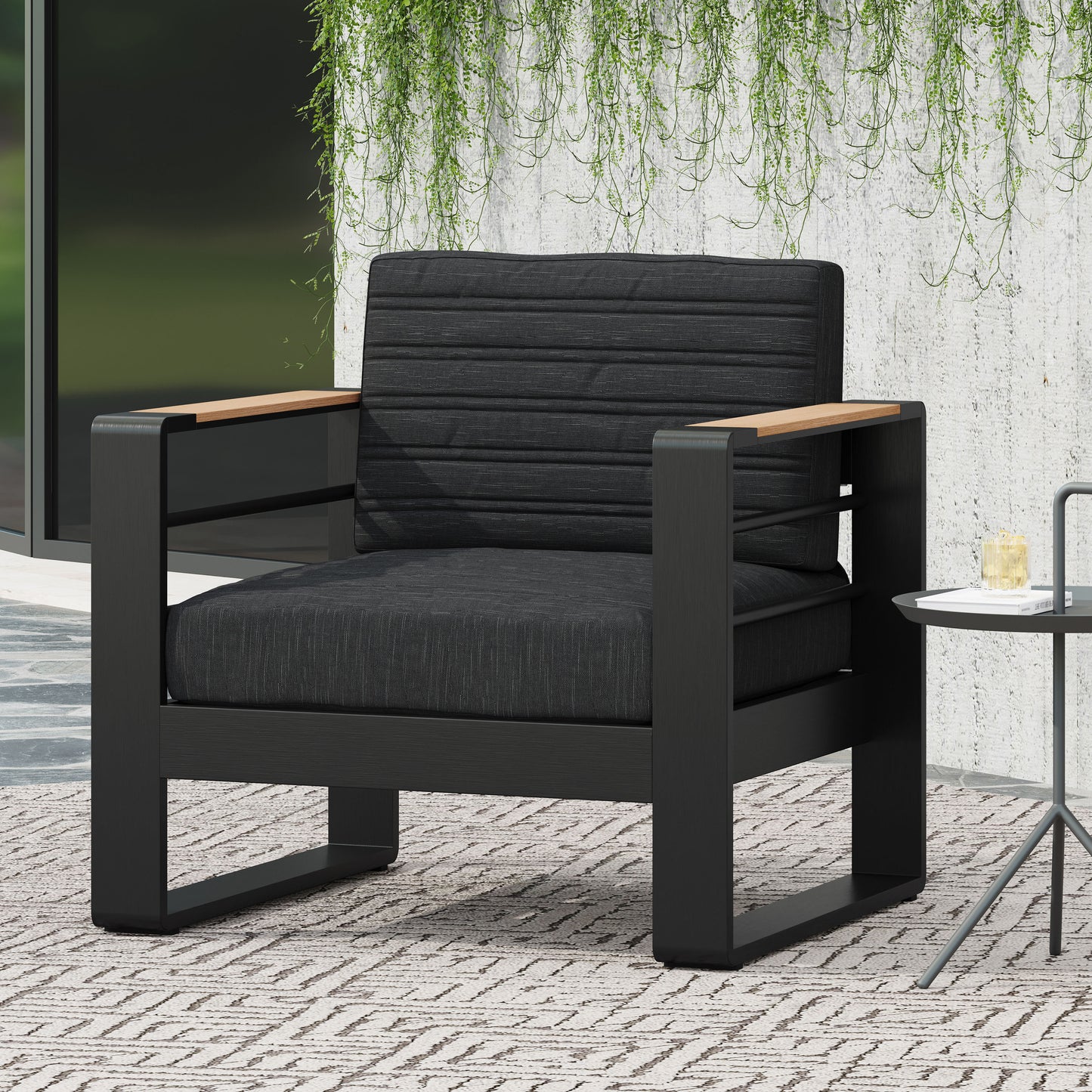 Modern black outdoor armchair with gray cushions and teak armrests perfect for patio relaxation