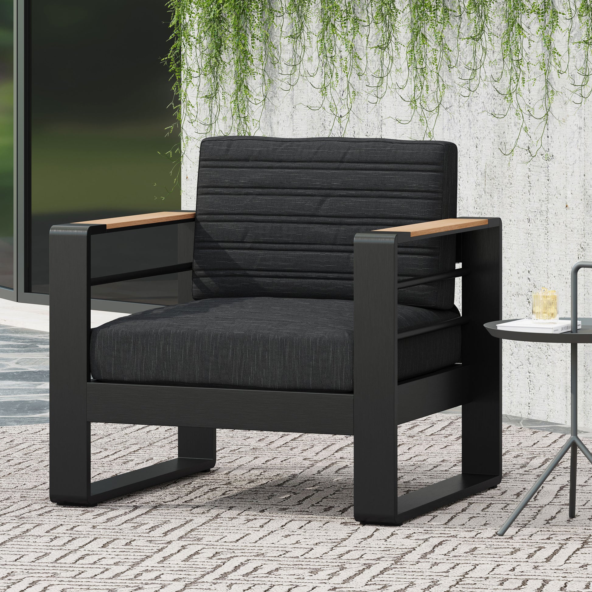 Modern black outdoor armchair with gray cushions and teak armrests perfect for patio relaxation