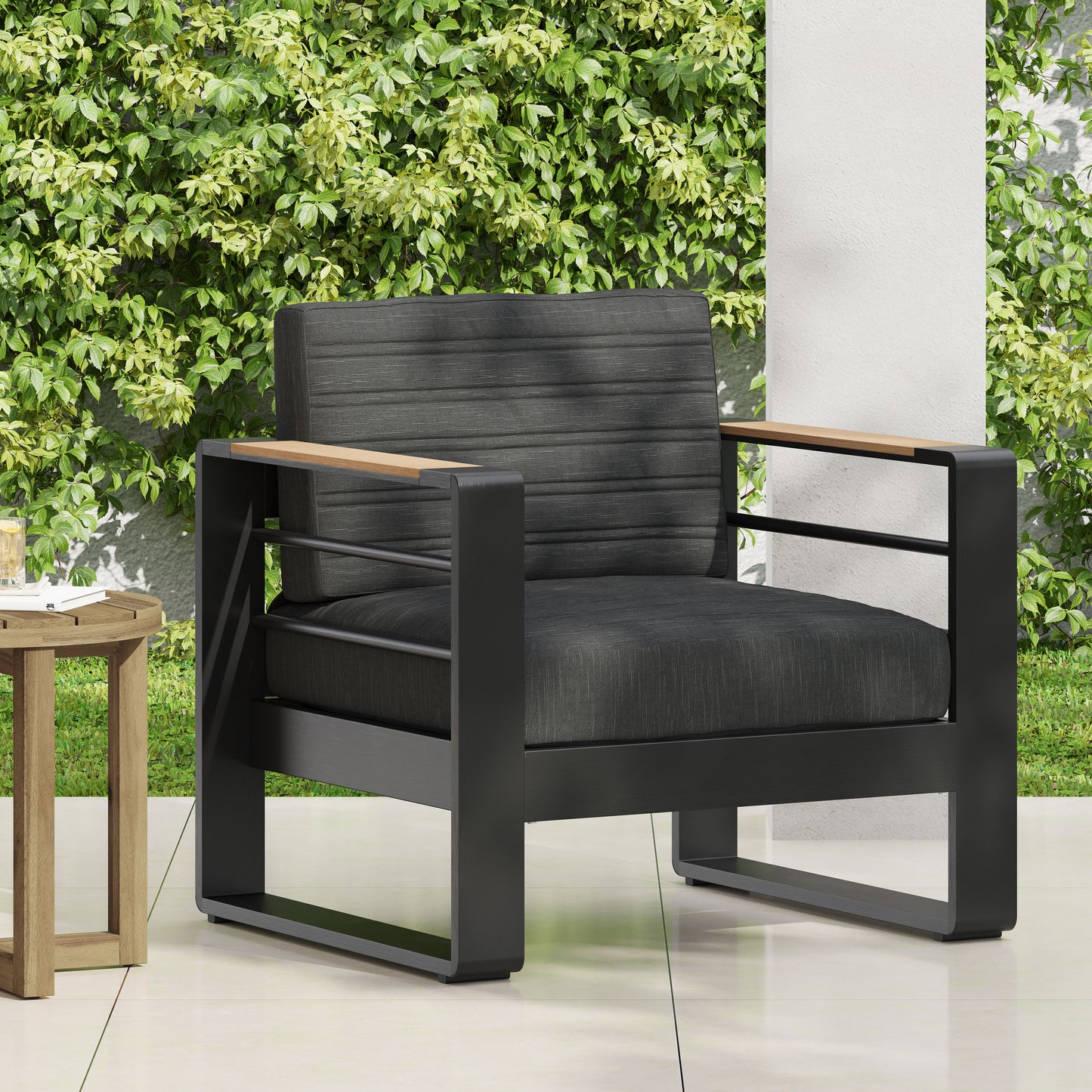 Modern dark gray outdoor armchair with wood accents and plush cushions