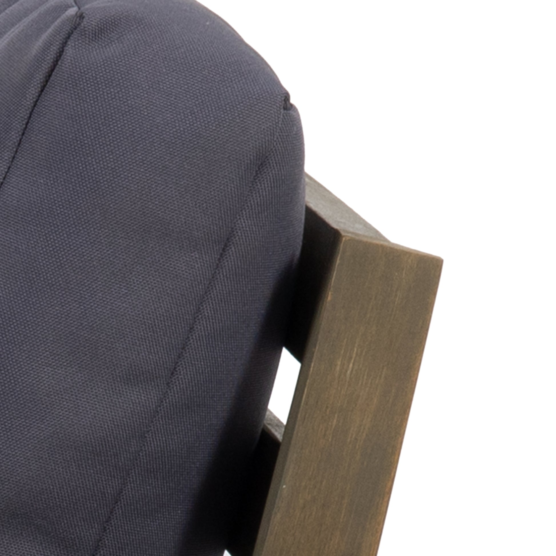 Closeup of a dark gray linen cushion for an outdoor chair showing textured fabric detail