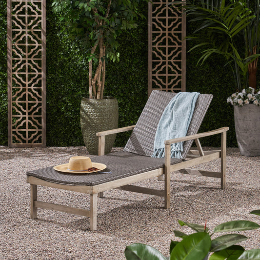 Gray woven chaise lounge with adjustable back includes light blue throw blanket and straw hat