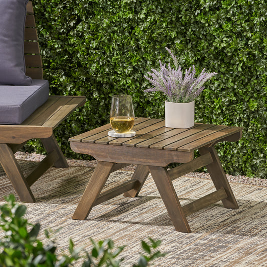 Dark brown slatted wood outdoor side table with metal accents perfect for patios