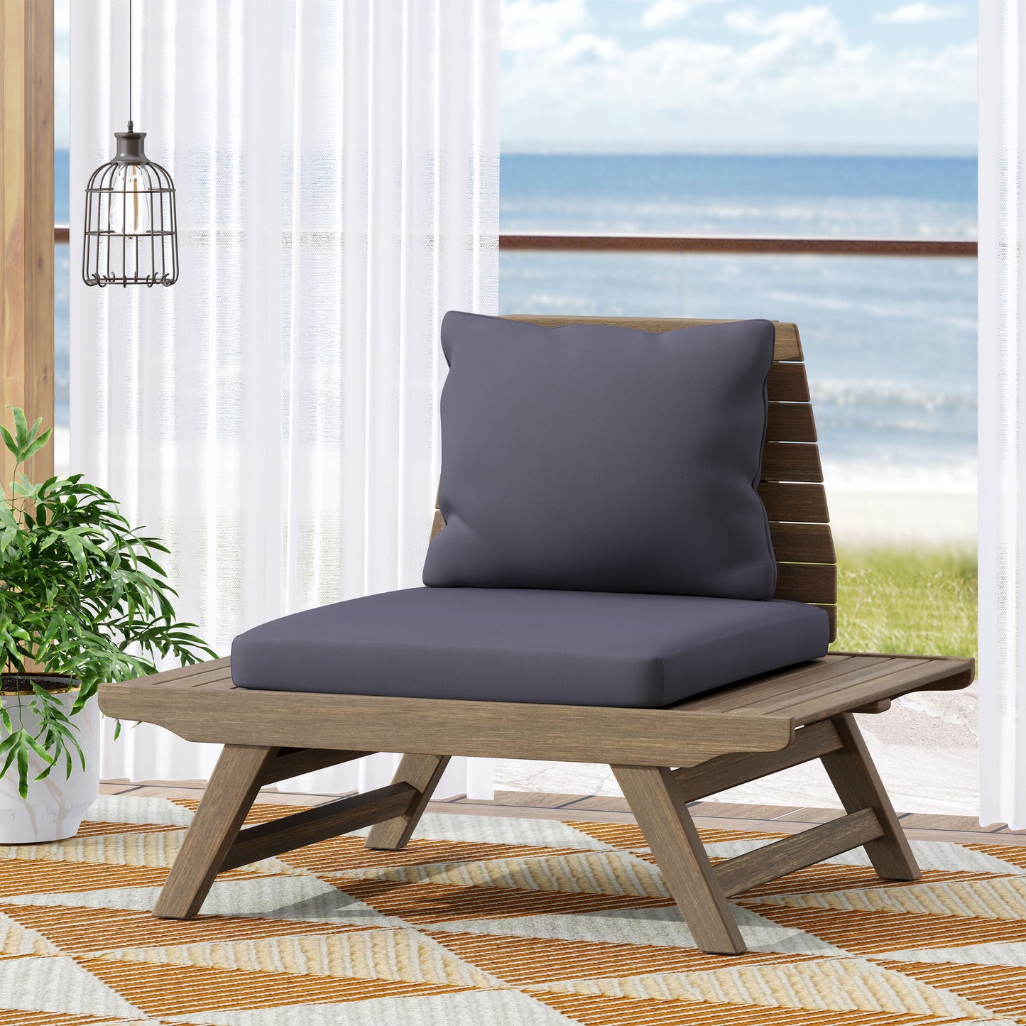 Wooden outdoor lounge chair with dark grey cushions and slatted back perfect for patios