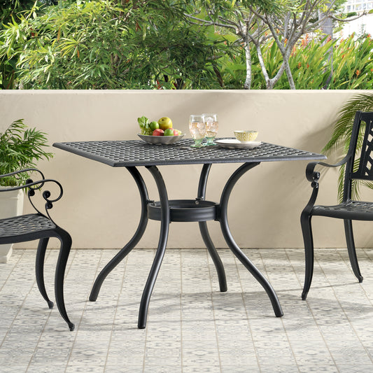 Square cast iron patio table with intricate lattice design and ornate legs perfect for outdoor dining