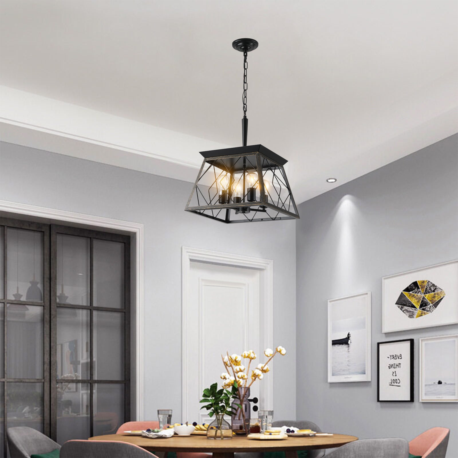 Black geometric cage pendant light with four exposed bulbs illuminating a dining room