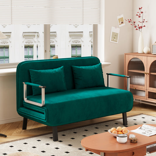Elegant emerald green velvet sofa bed with chrome accents and matching pillows