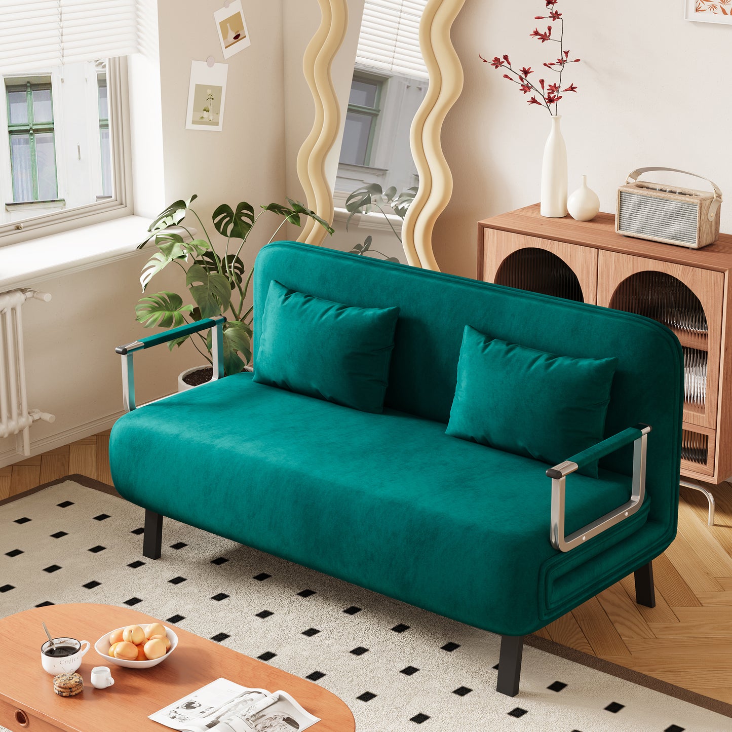 Teal velvet futon sofa with two matching throw pillows and chrome arms perfect for small spaces