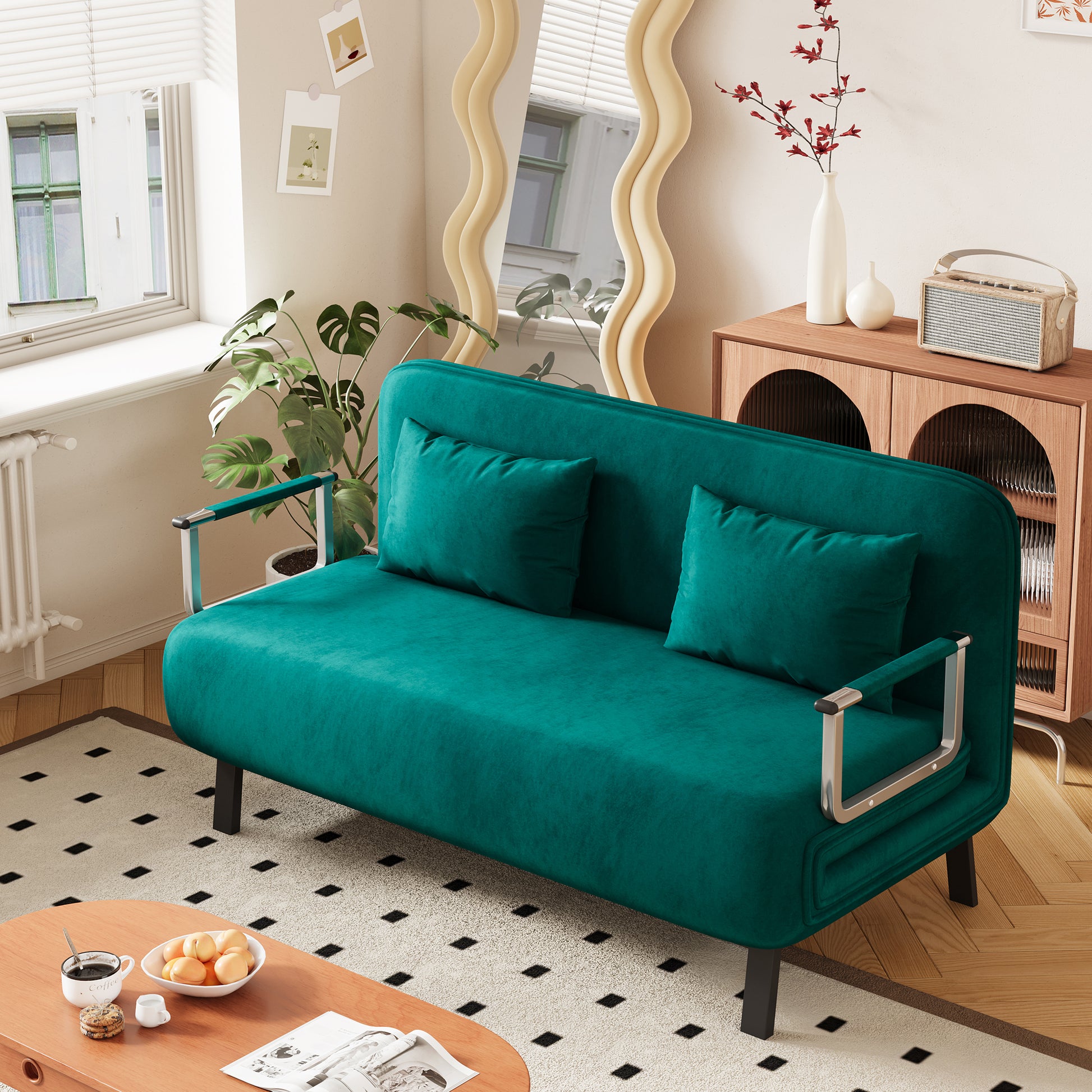 Teal velvet futon sofa with two matching throw pillows and chrome arms perfect for small spaces