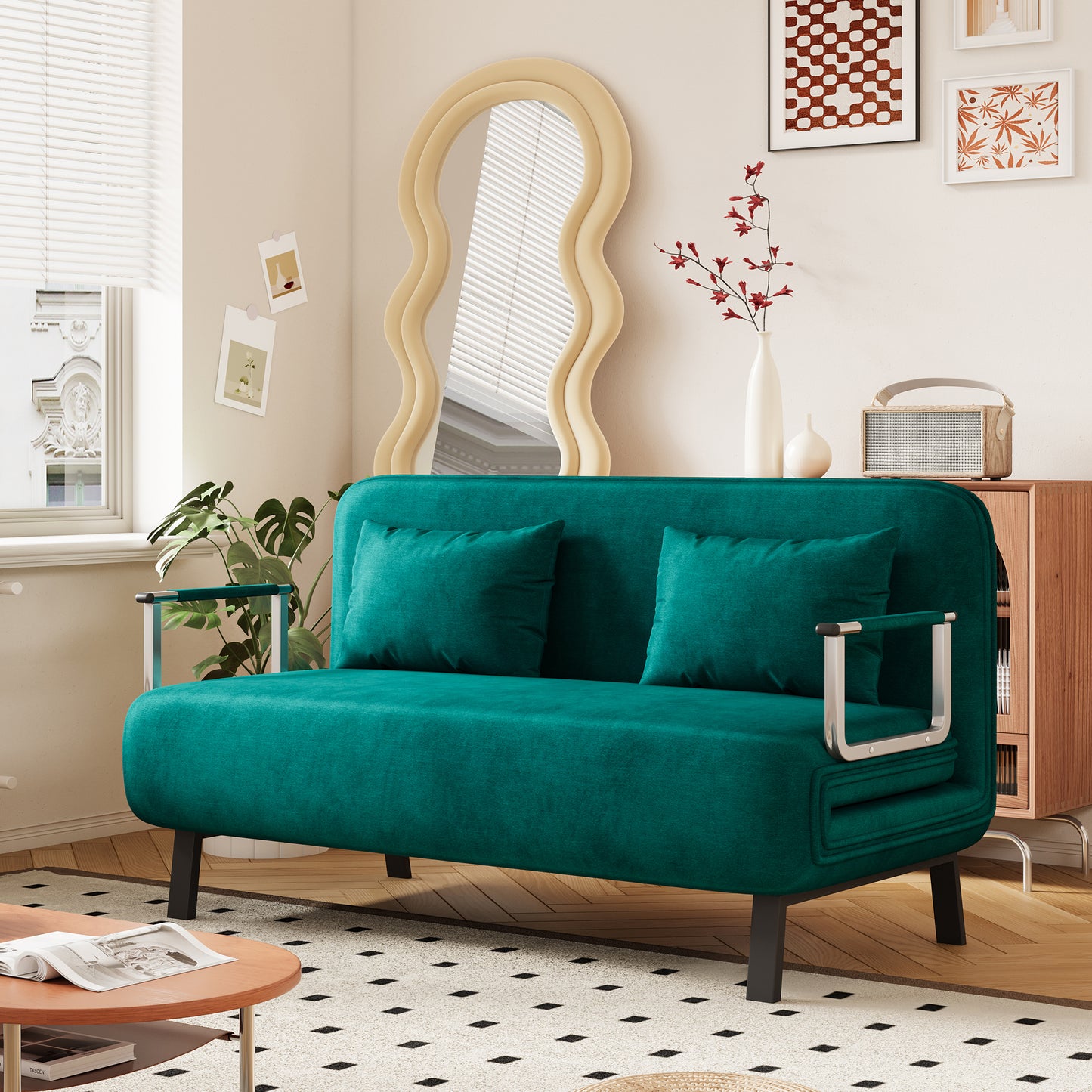 Teal velvet sofa with two matching throw pillows and sleek chrome arms