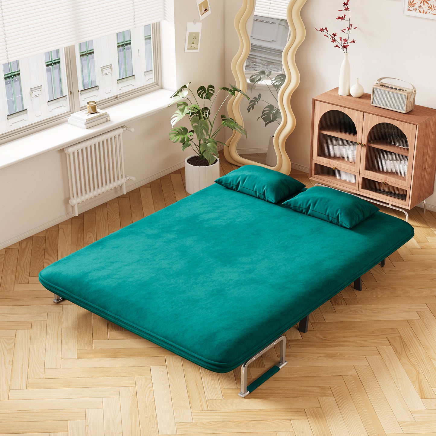 Emerald green velvet futon with two matching pillows metal frame for a modern living room