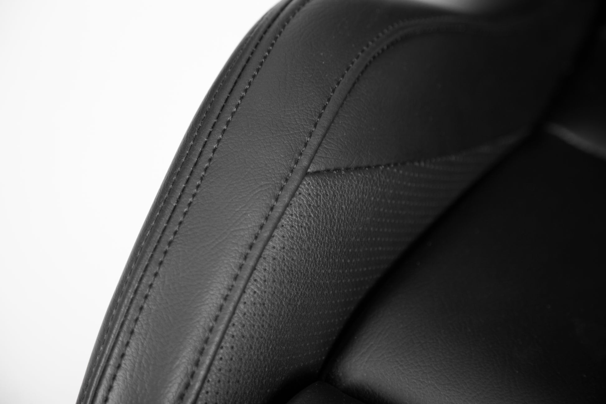 Black leather car seat bolster with detailed stitching premium upholstery