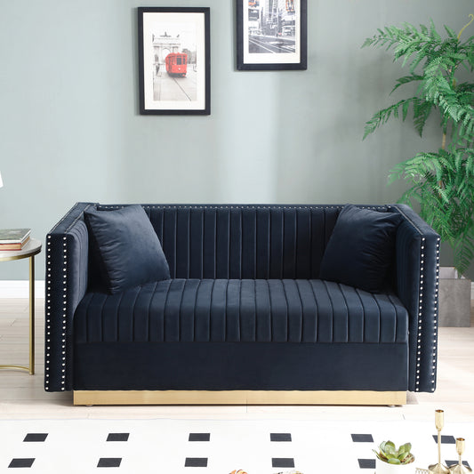 Navy velvet sofa with channel tufting silver nailhead trim and gold base