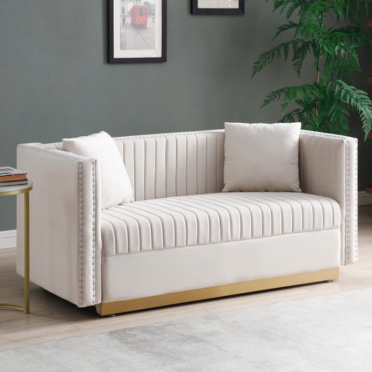 Elegant cream velvet sofa with channel tufting and gold base