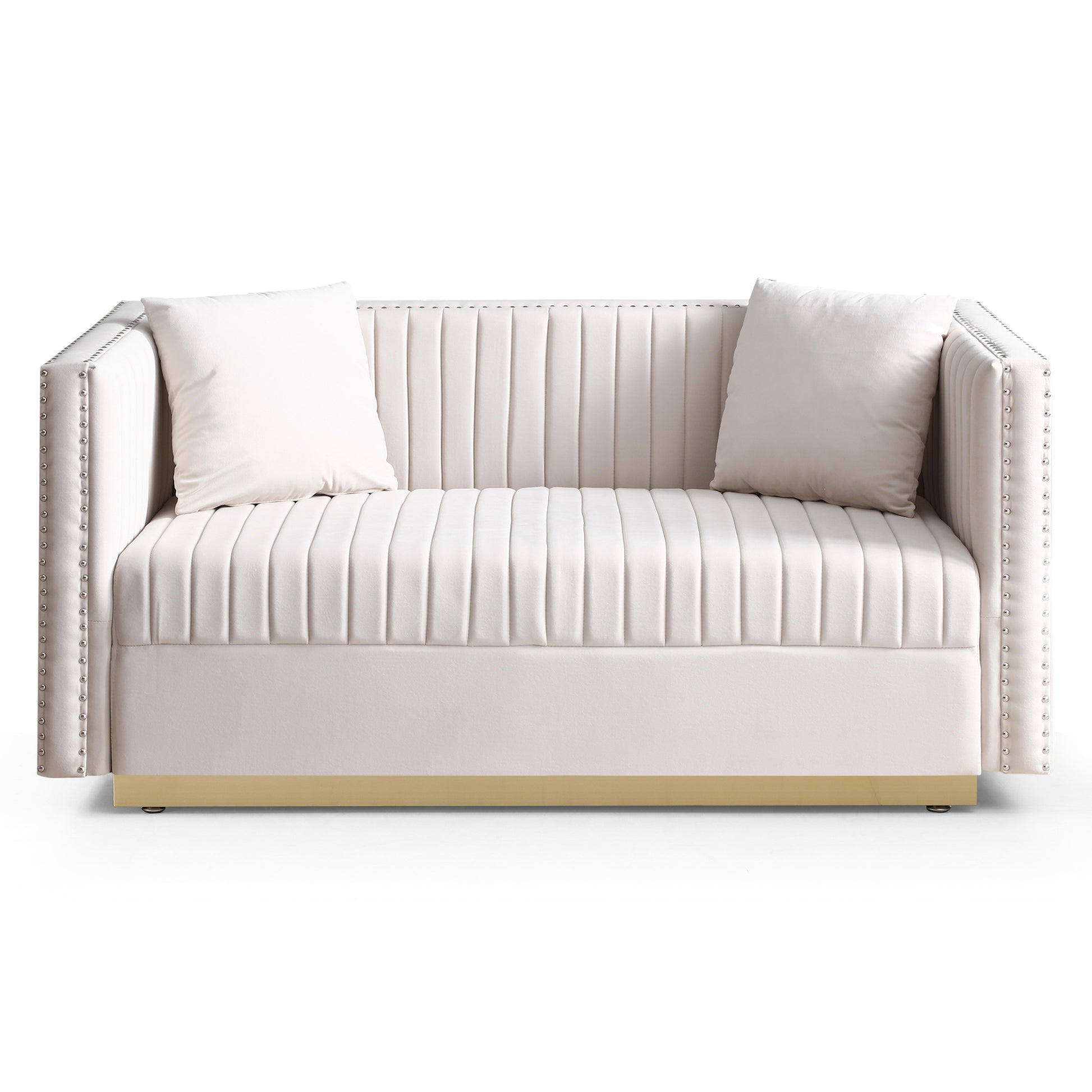 Cream velvet sofa with channel tufting and silver nailhead trim