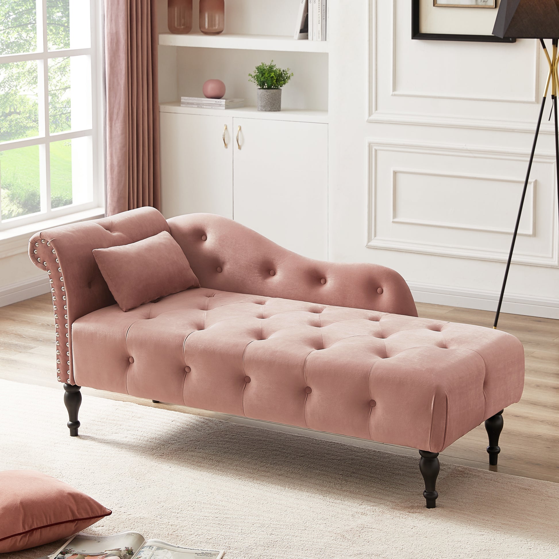 Elegant pink velvet chaise lounge with button tufting and silver nailhead trim
