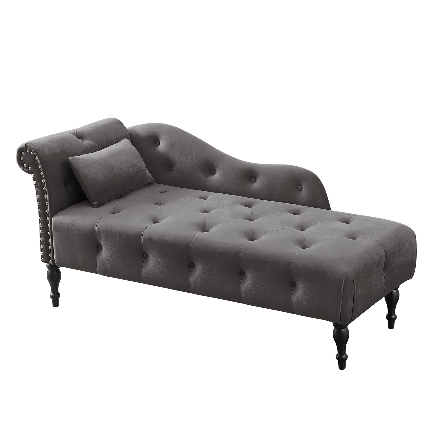 Tufted grey velvet chaise lounge with silver nailhead trim and a decorative pillow