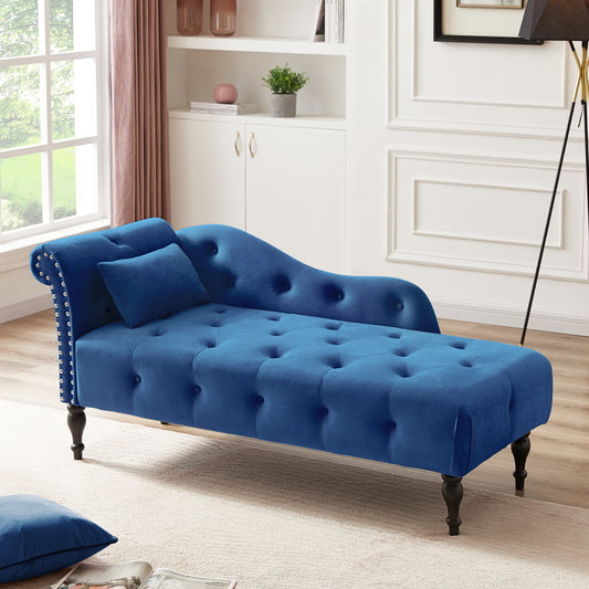 Deep blue velvet chaise lounge with tufted seat and silver nailhead trim perfect for a living room