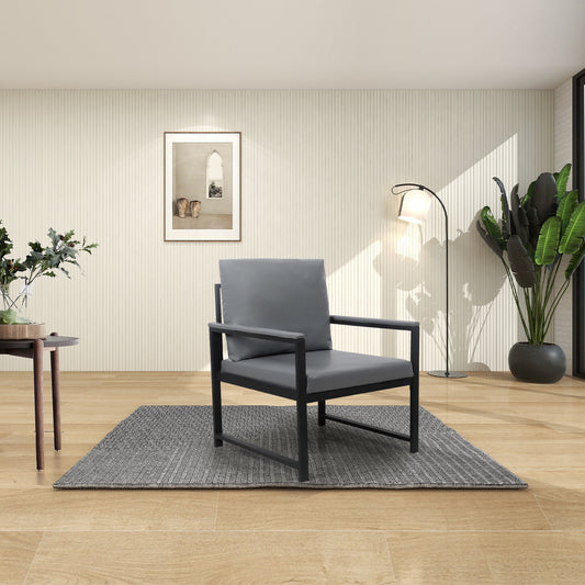 Modern grey armchair with black metal frame on a woven rug