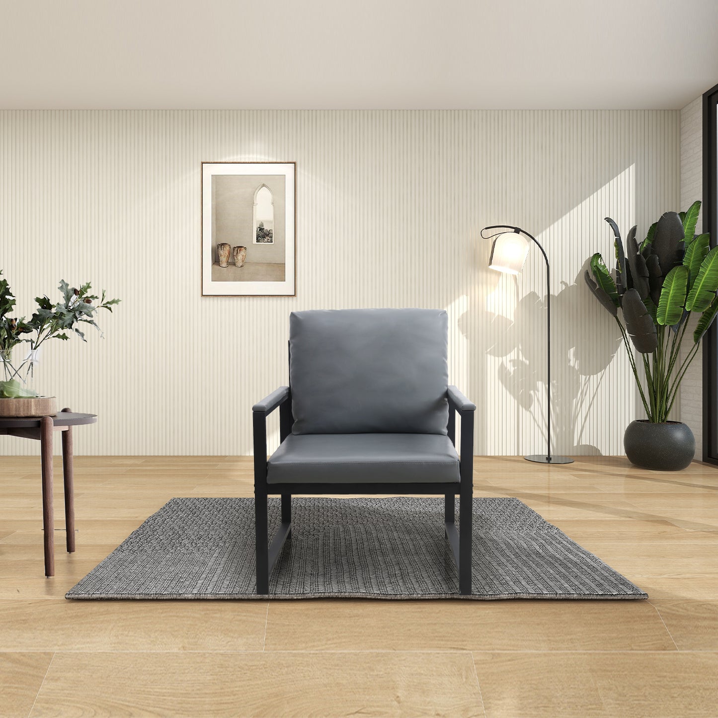 Gray upholstered armchair with black metal frame on a textured rug