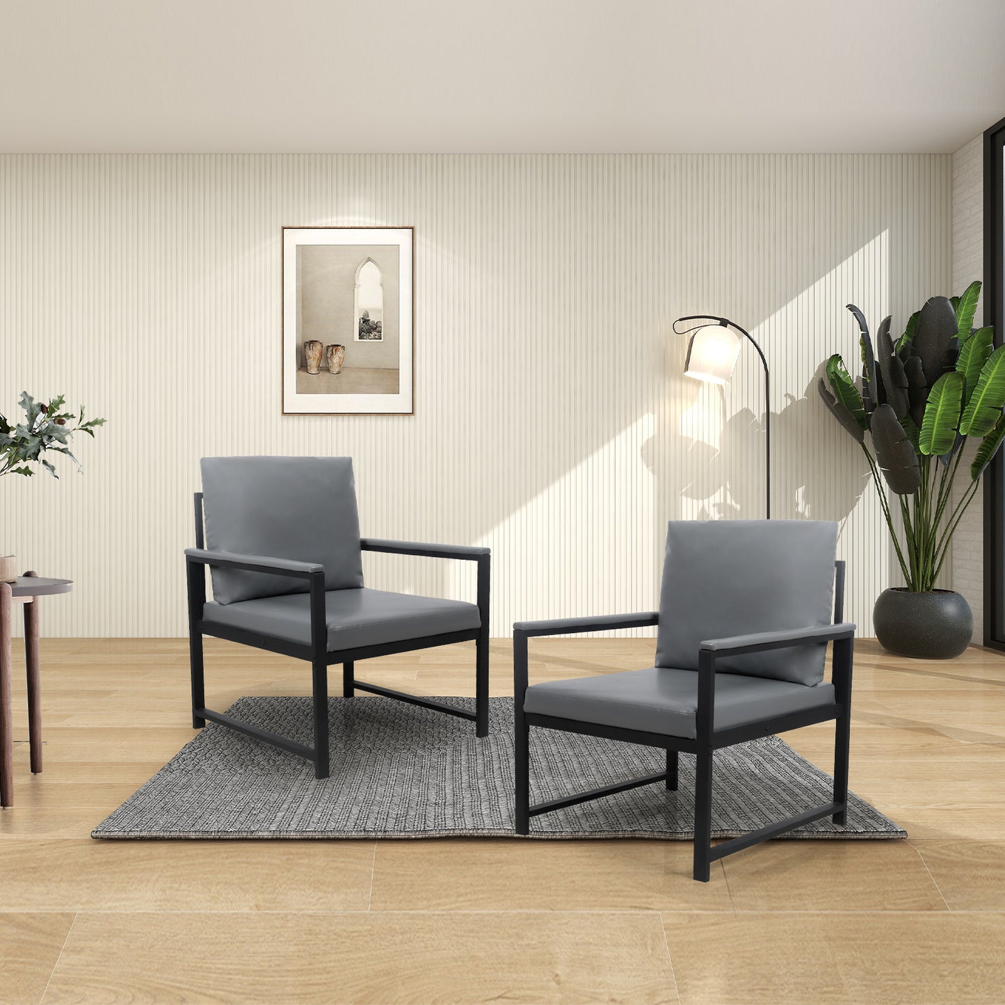 Two modern grey accent chairs with black metal frames on a rug