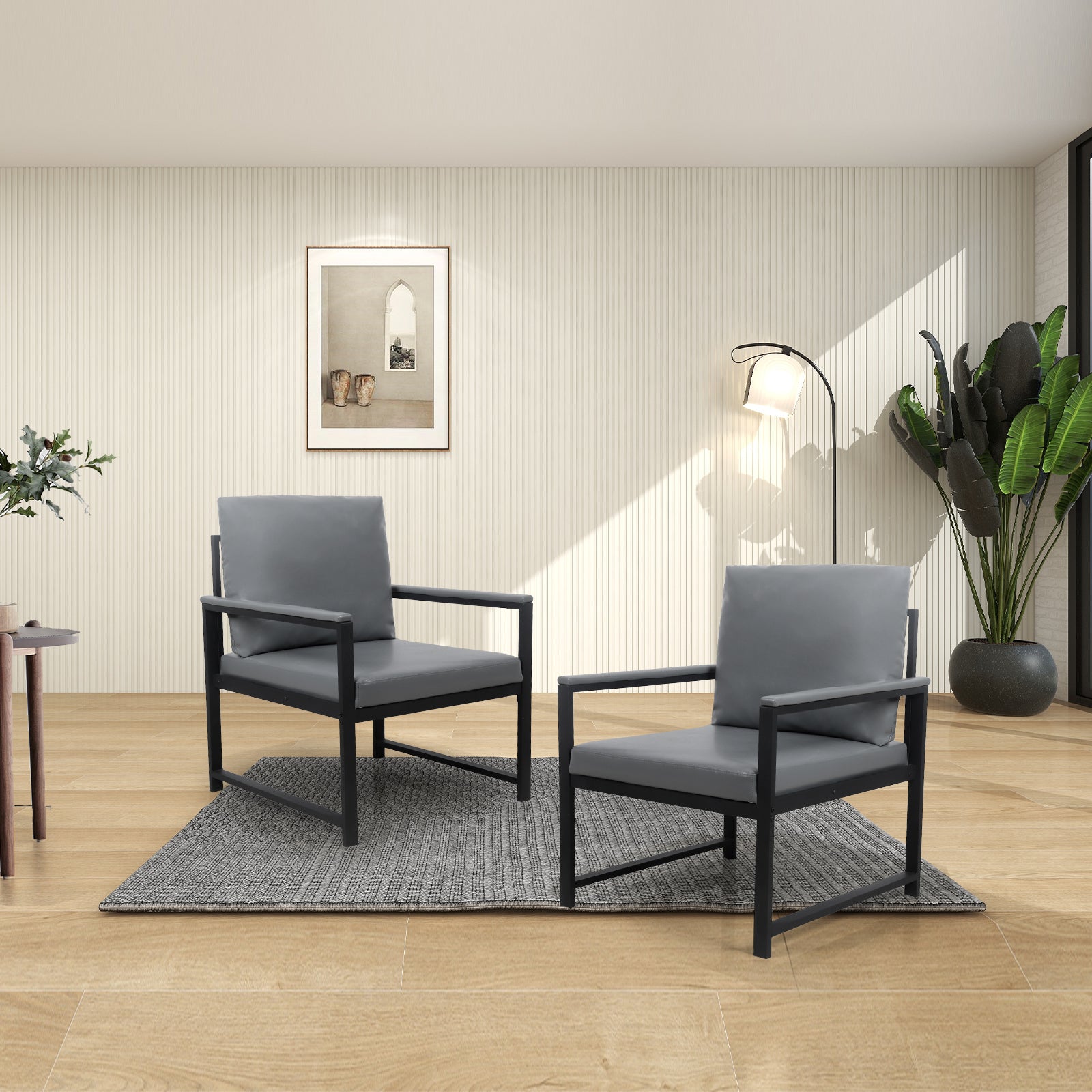 Two modern grey accent chairs with black metal frames on a rug