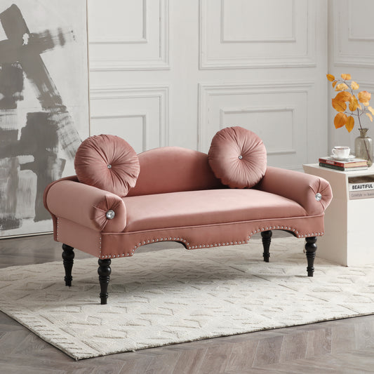 Dusty rose velvet loveseat with ornate silver nailhead trim and tufted round throw pillows