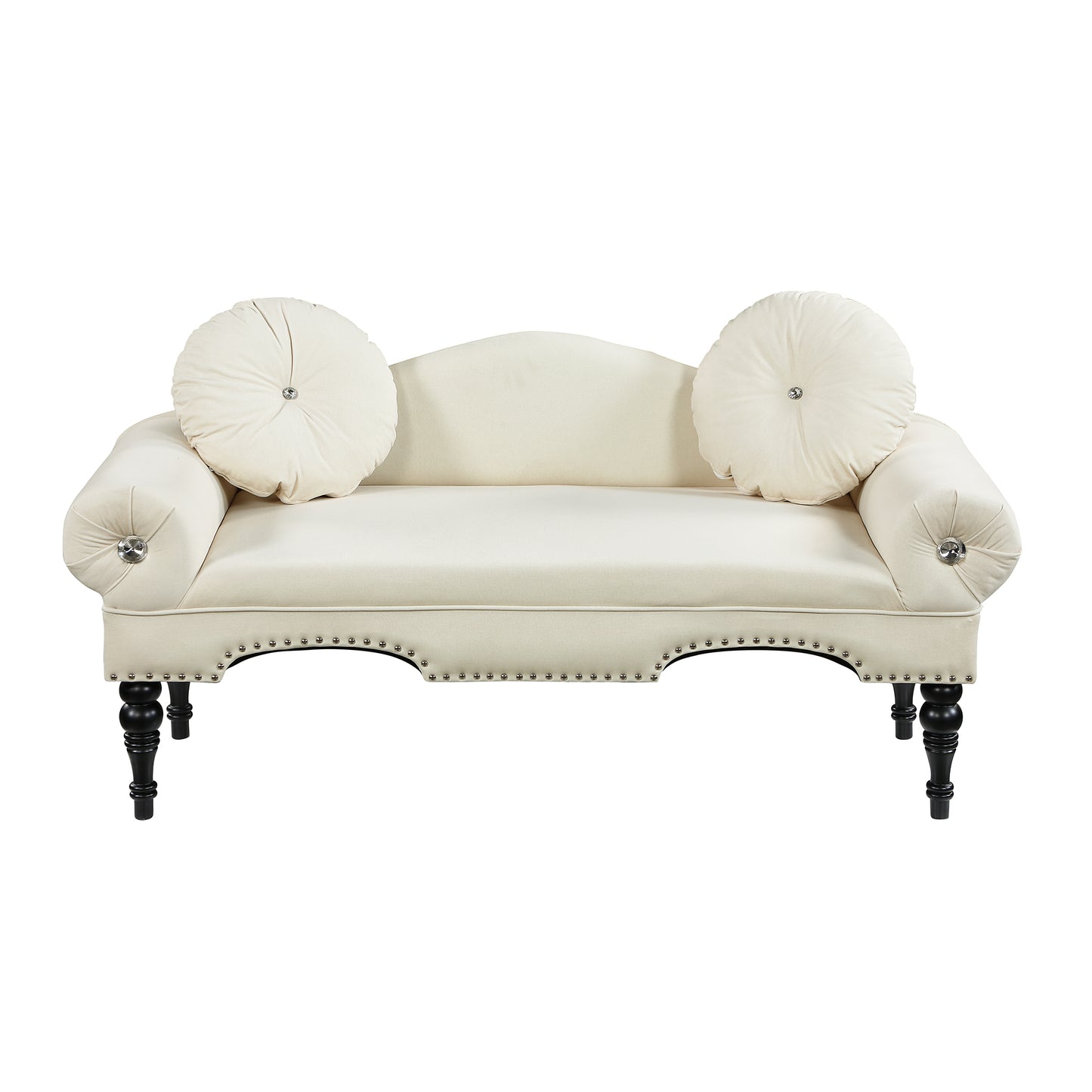 Cream velvet loveseat with ornate details and round throw pillows