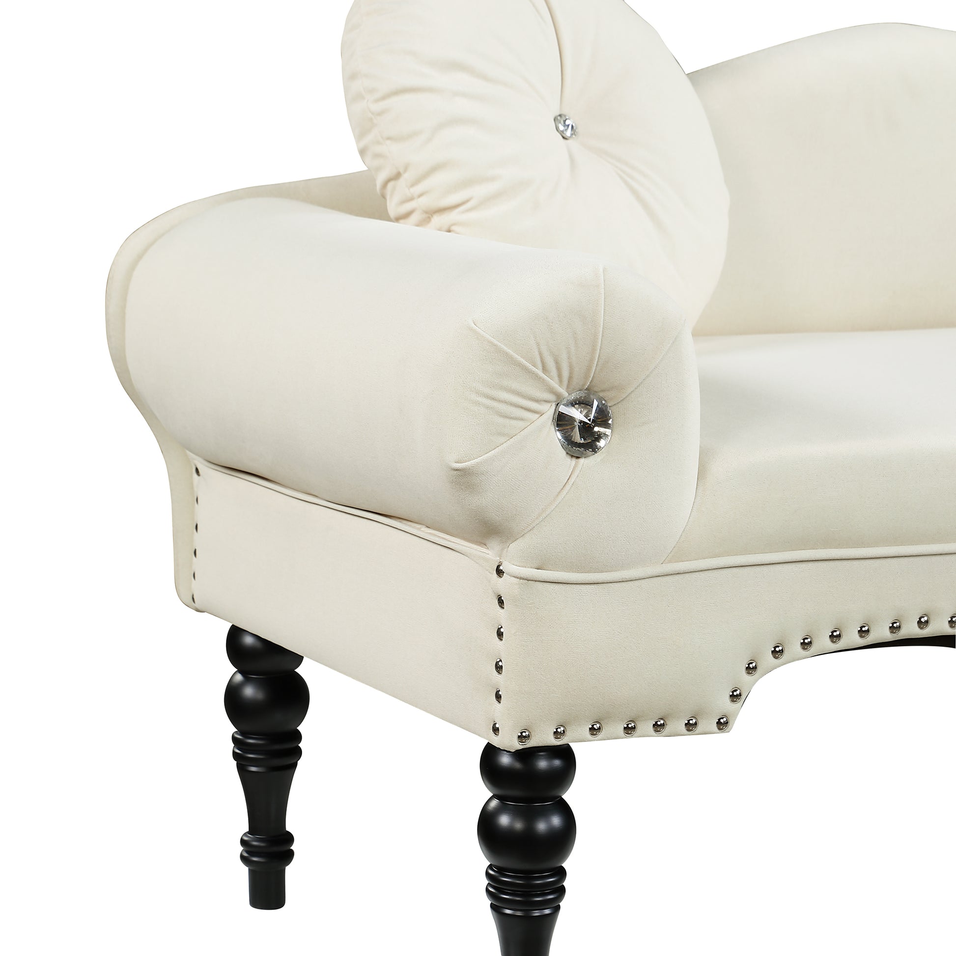 Cream velvet armchair with diamond tufting and black turned legs