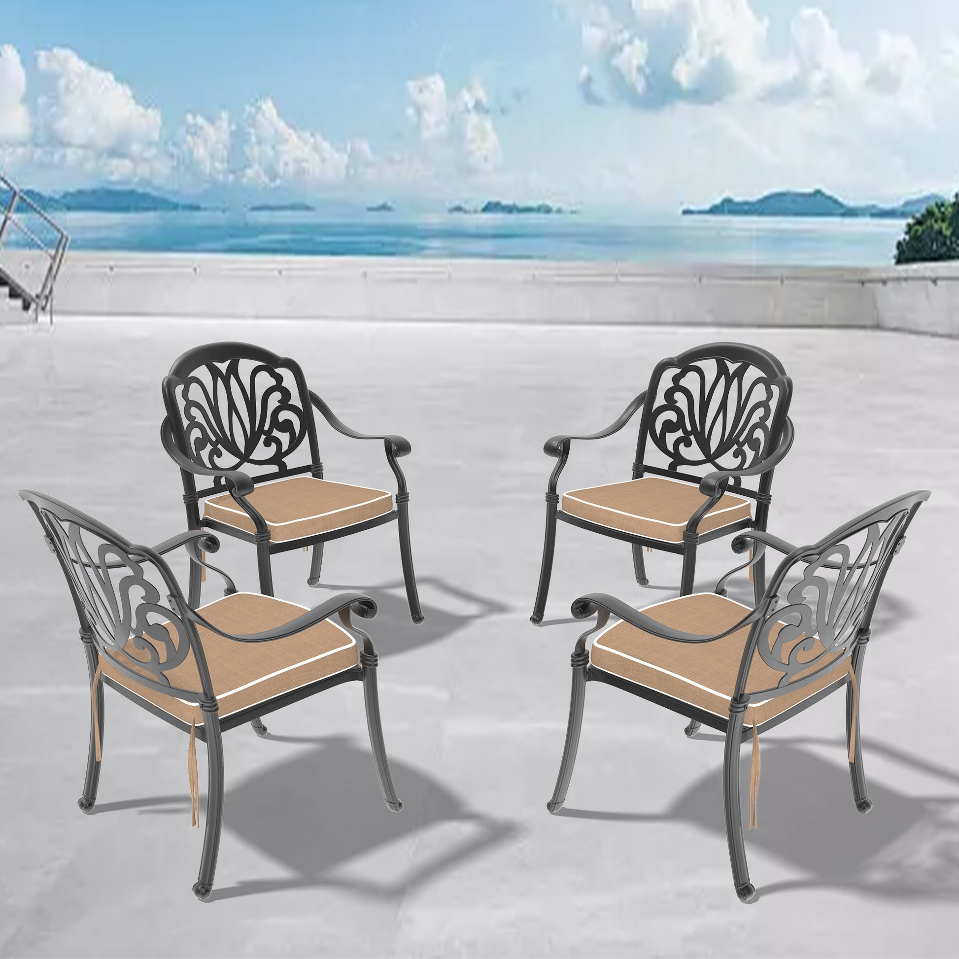Four black ornate metal patio chairs with tan cushions and white piping arranged outdoors