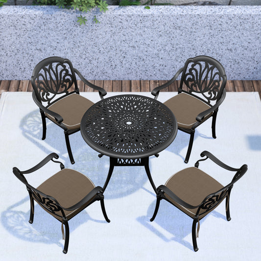 Black ornate cast aluminum patio dining set with four chairs and round table