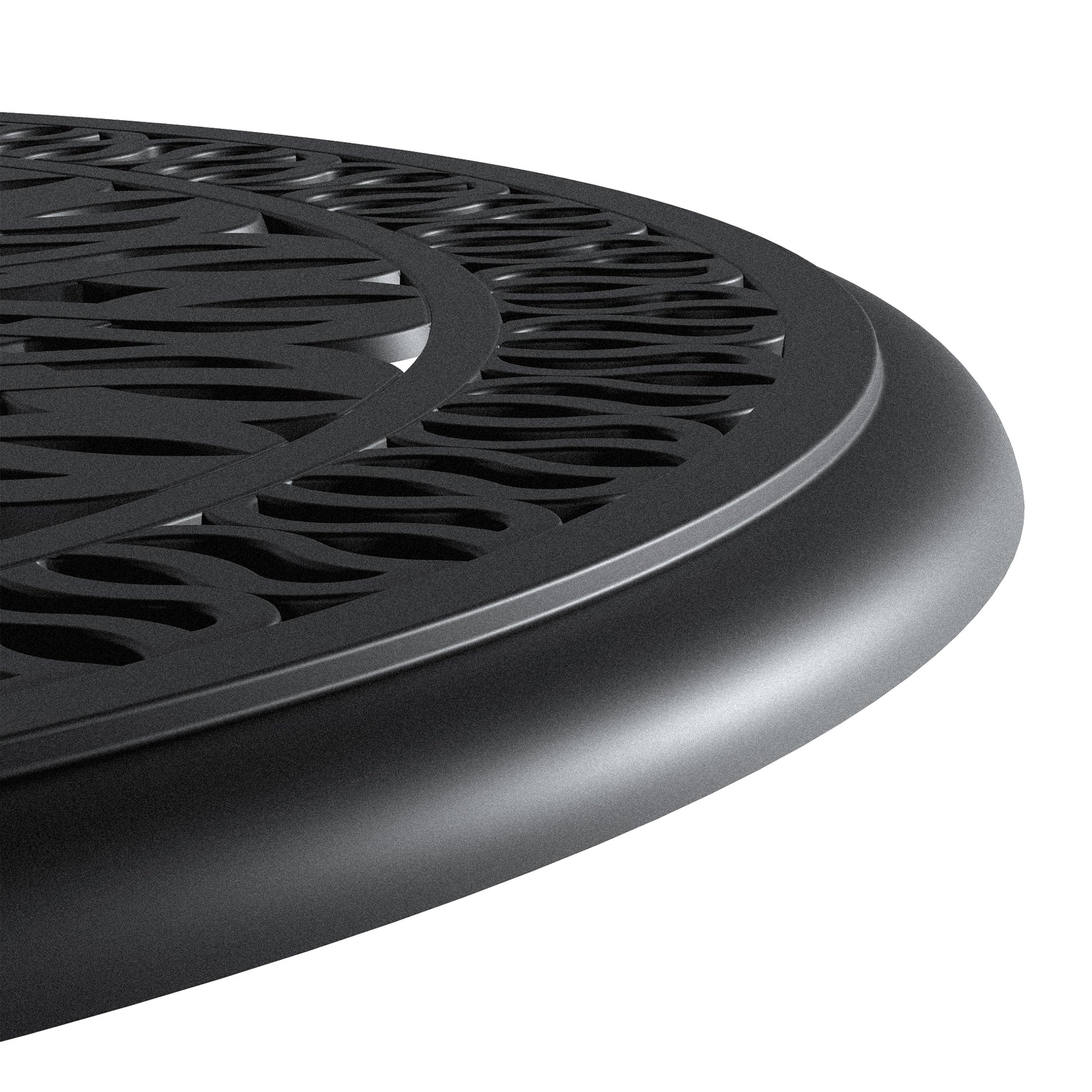 Black metal round table top with ornate wave pattern details for outdoor seating