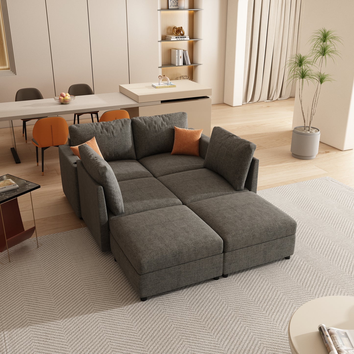 Sectional charcoal gray fabric sofa with orange accent pillows perfect for living rooms
