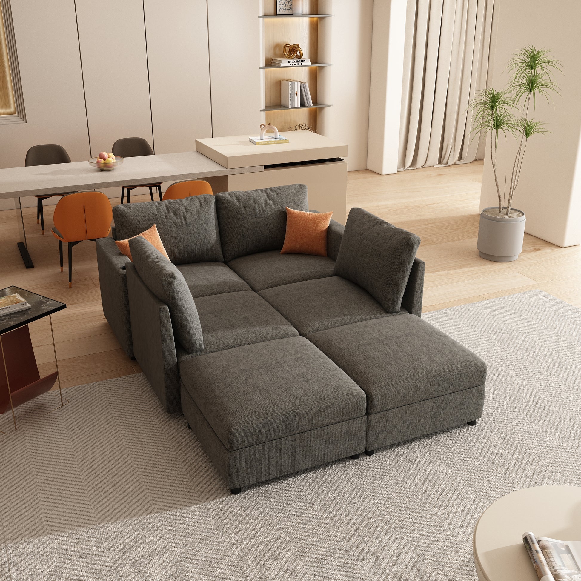 Sectional charcoal gray fabric sofa with orange accent pillows perfect for living rooms