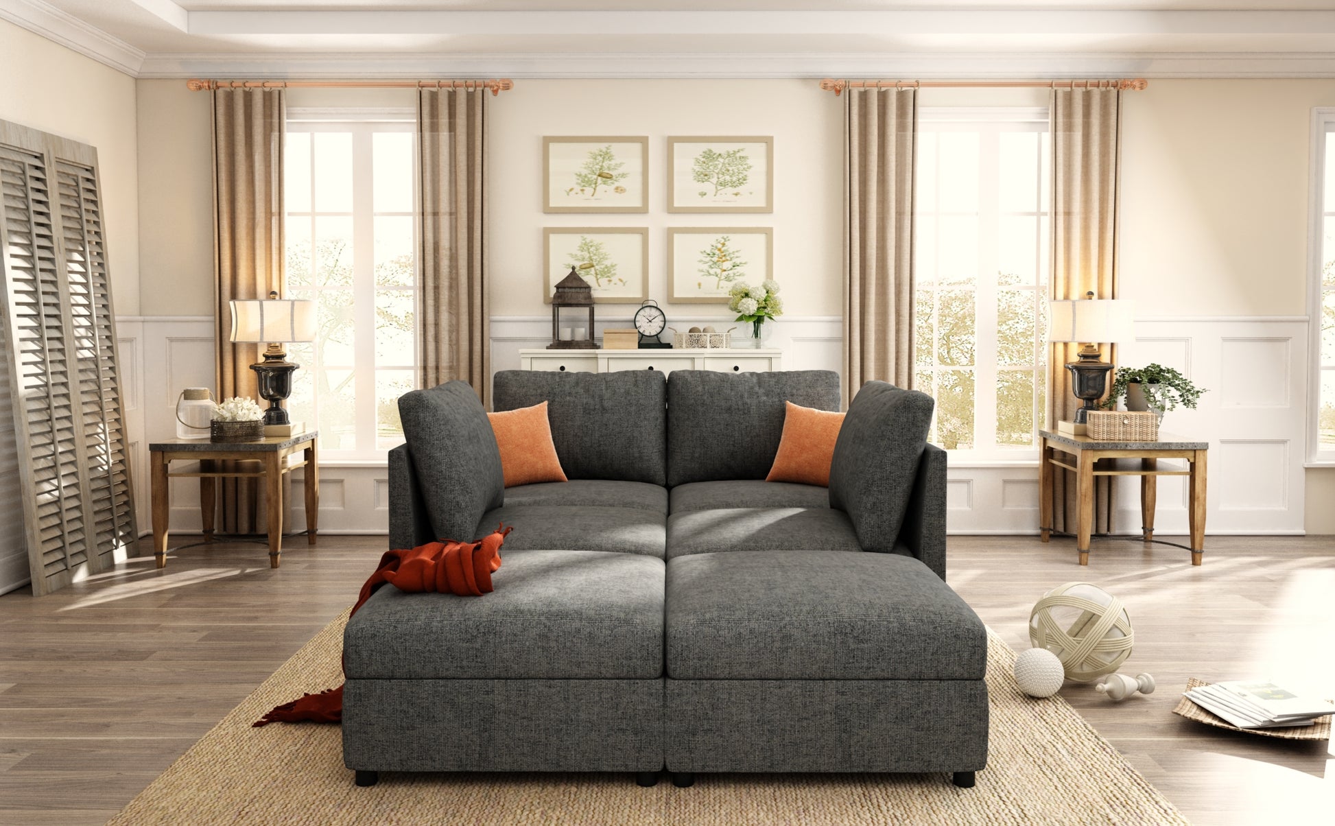 Dark gray sectional sofa with chaise and orange accent pillows perfect for modern living rooms