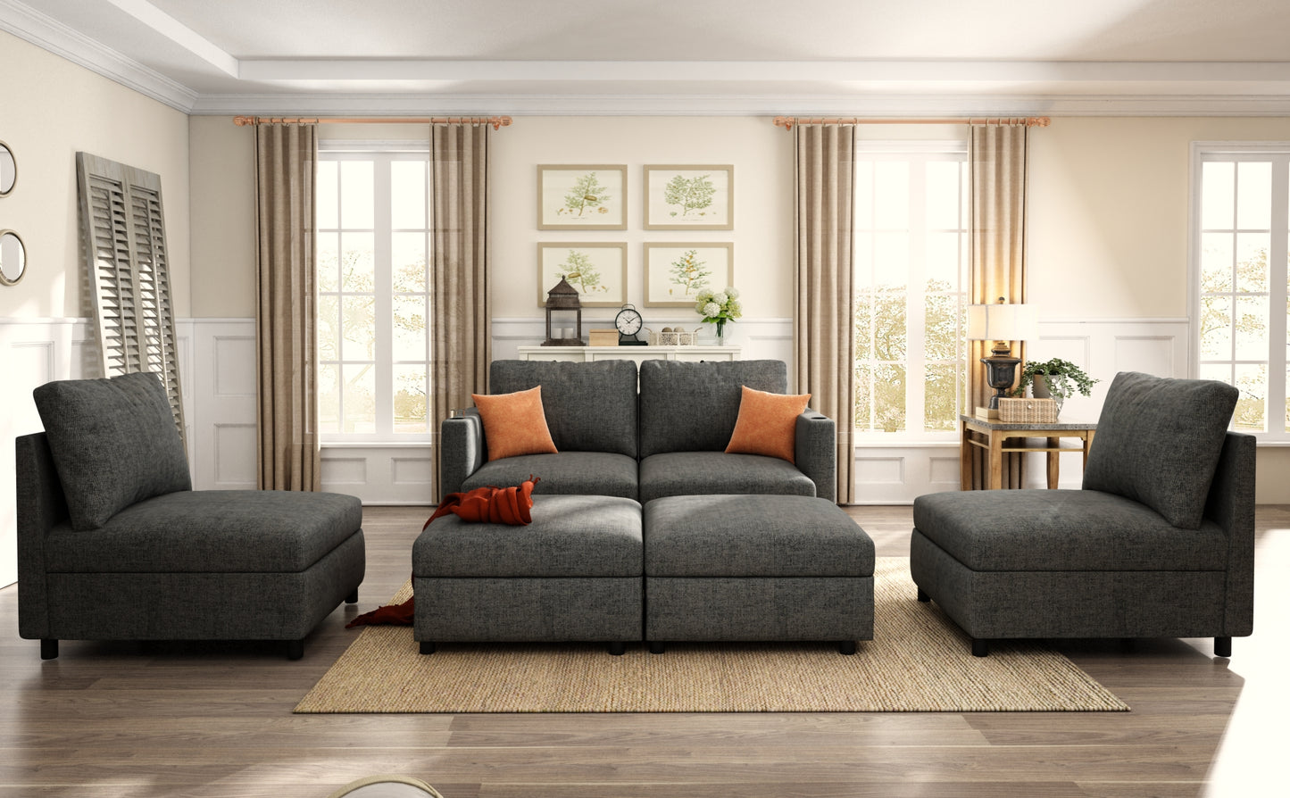 Dark gray sectional sofa with orange accent pillows and matching ottomans