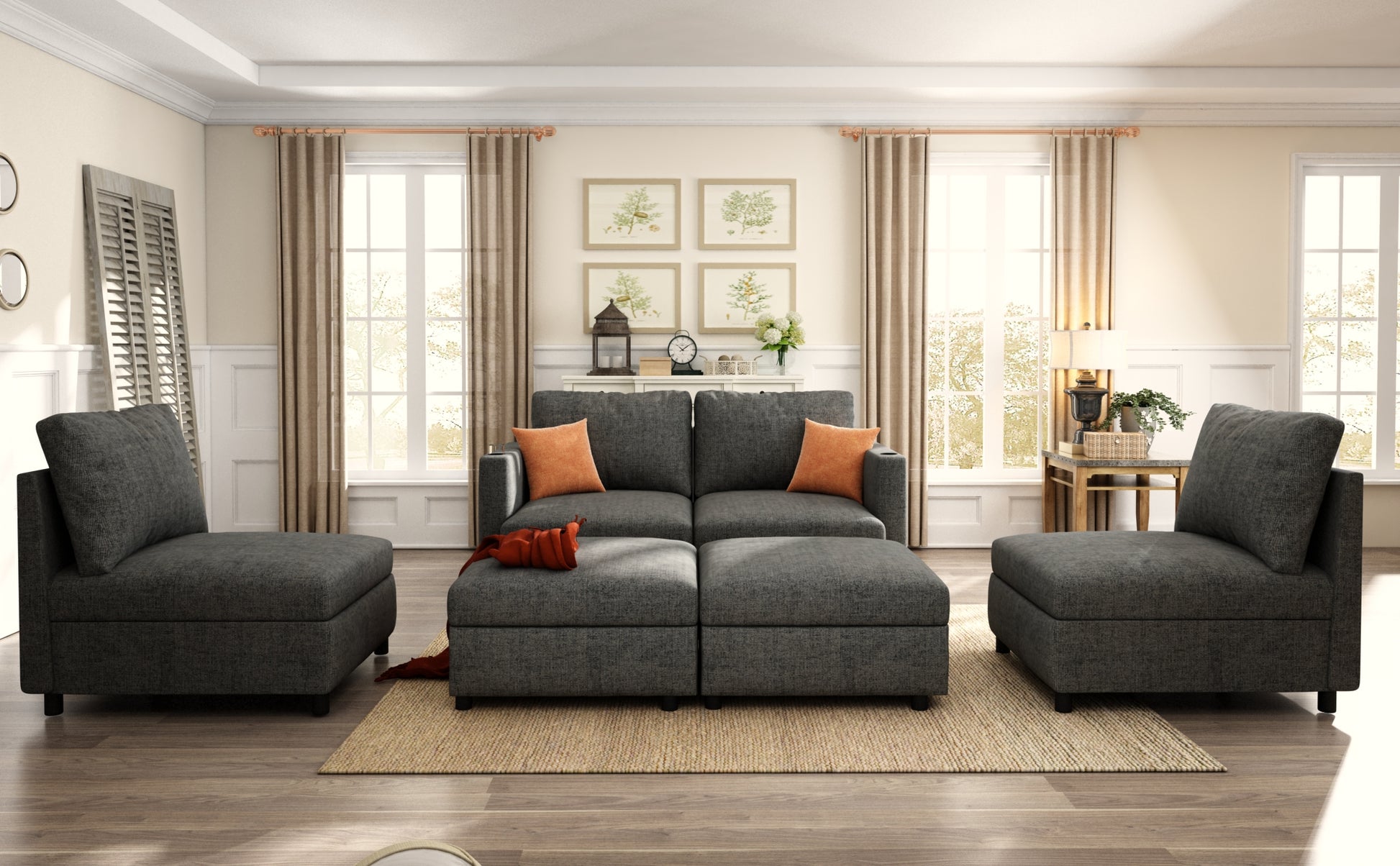 Dark gray sectional sofa with orange accent pillows and matching ottomans