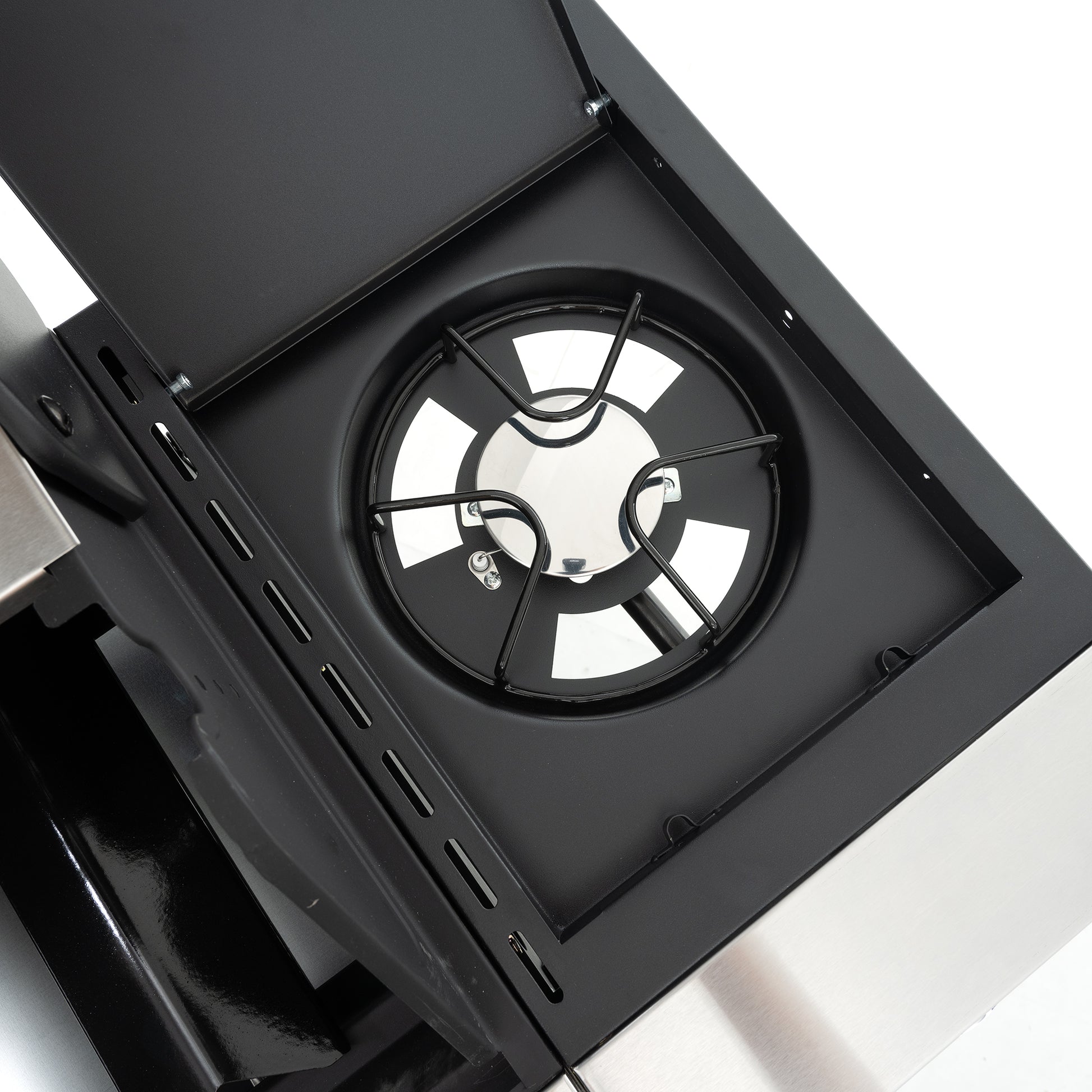 Black gas hob burner grate with stainless steel central cap and reflective surface