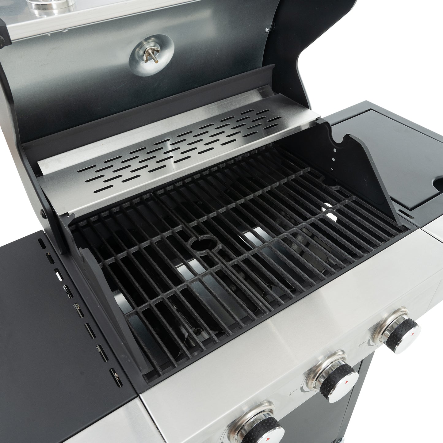 Stainless steel gas grill interior with black grate and warming rack