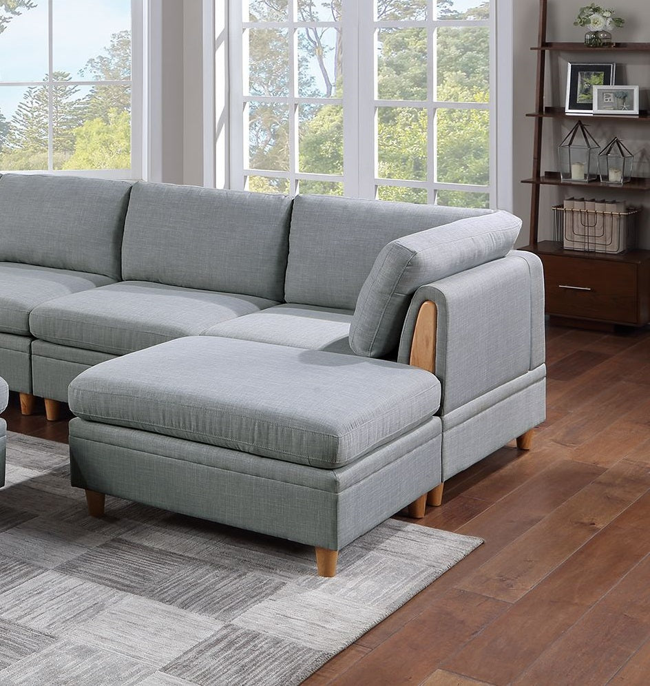 Light gray sectional sofa with chaise featuring wooden accents and plush cushions