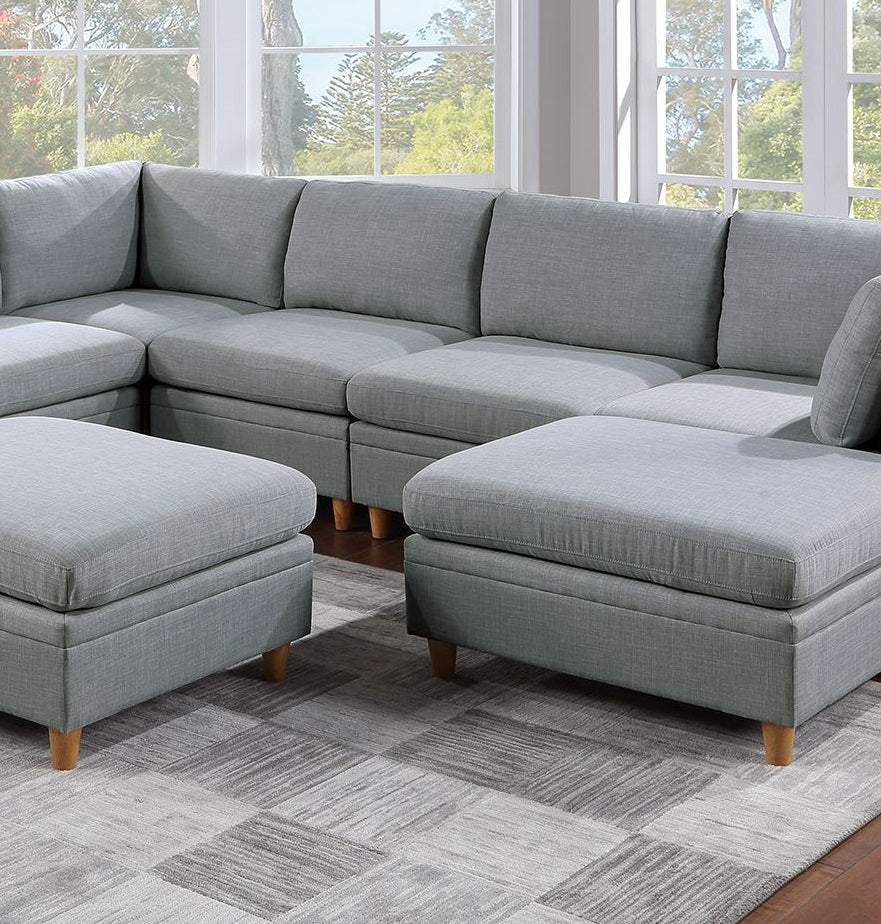 Gray fabric sectional sofa with two matching ottomans perfect for living room seating