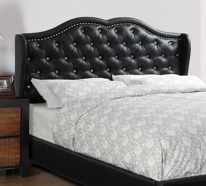 Black faux leather headboard with diamond tufting and crystal accents complementing a modern bedroom